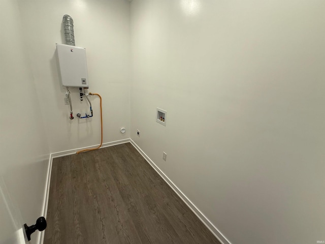 laundry area with dark hardwood / wood-style flooring, gas dryer hookup, hookup for a washing machine, and water heater