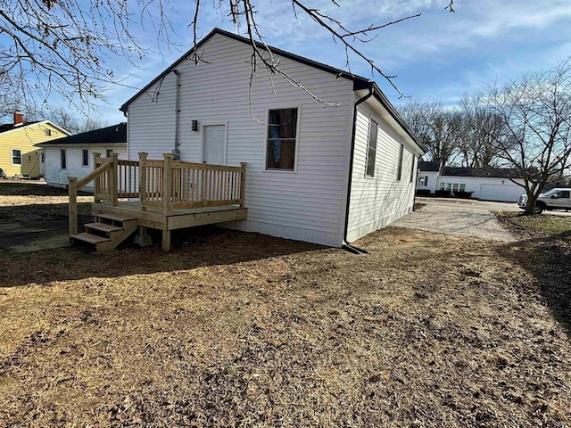 rear view of property with a deck