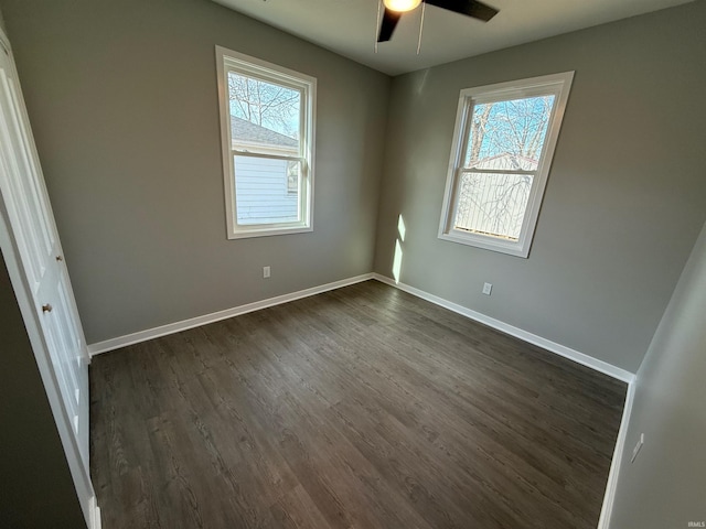 unfurnished room featuring dark hardwood / wood-style flooring and ceiling fan