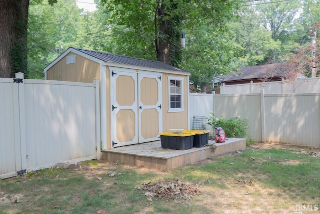 view of shed with a fenced backyard