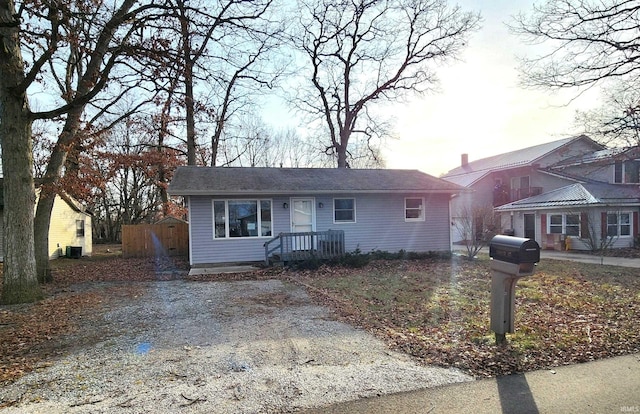 view of front facade with a storage shed