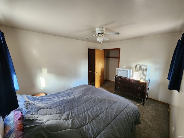 bedroom with an AC wall unit, ceiling fan, and dark colored carpet