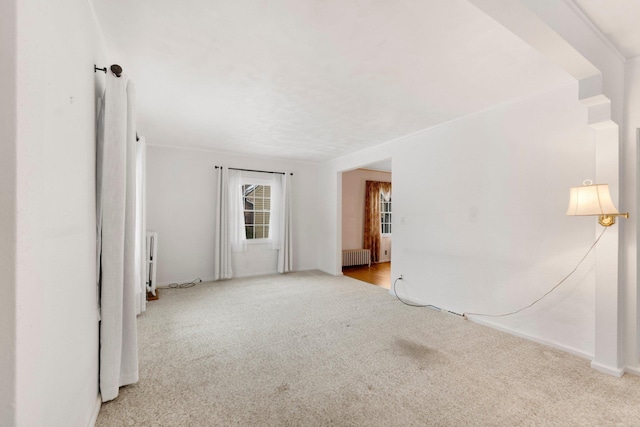 carpeted spare room with radiator