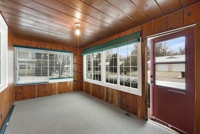 unfurnished sunroom with wood ceiling