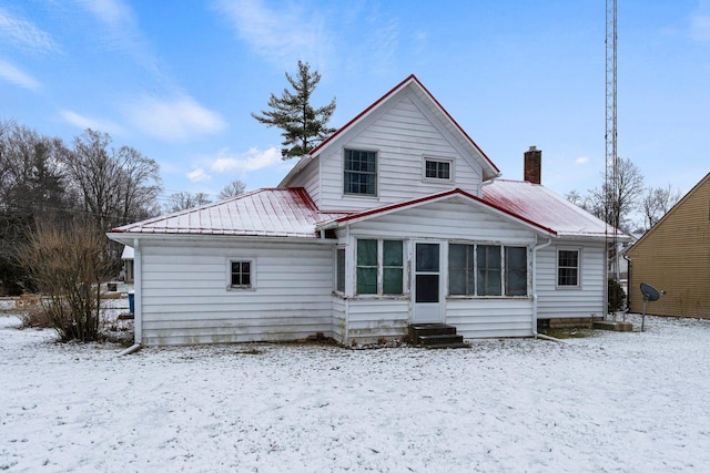 view of snow covered house