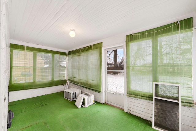 unfurnished sunroom featuring a healthy amount of sunlight