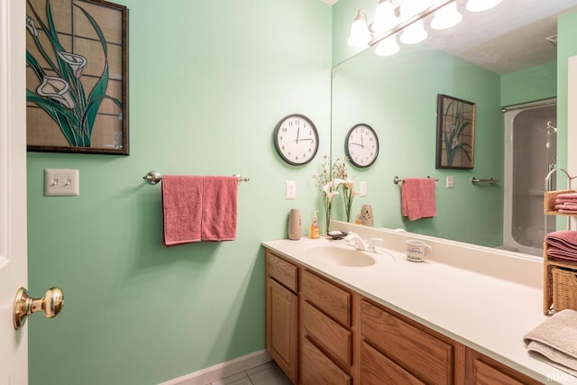 bathroom featuring tile patterned floors and vanity