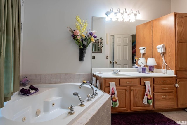 bathroom featuring vanity, tiled bath, and tile patterned floors