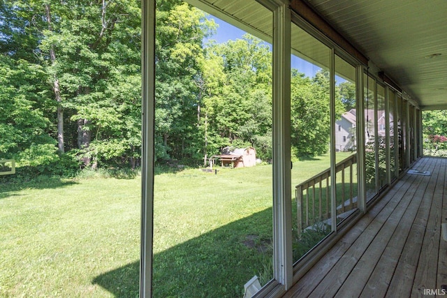 wooden terrace with a yard