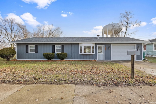 ranch-style house with a front yard and a garage