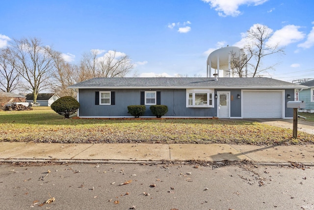 ranch-style home with a garage and a front yard