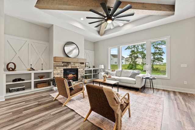 living room with a fireplace, hardwood / wood-style floors, and ceiling fan