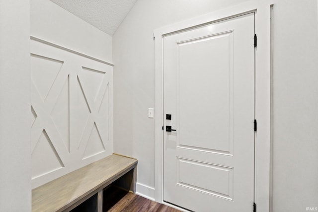 mudroom featuring dark hardwood / wood-style flooring and a textured ceiling