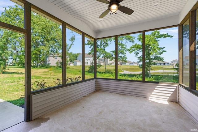 unfurnished sunroom with ceiling fan and a healthy amount of sunlight