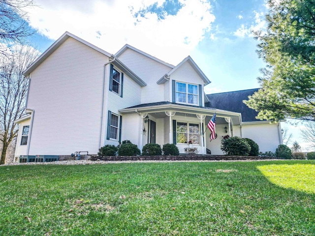 view of front facade with covered porch and a front lawn