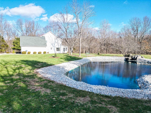 view of pool with a lawn