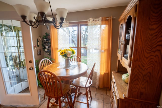 dining space featuring a notable chandelier