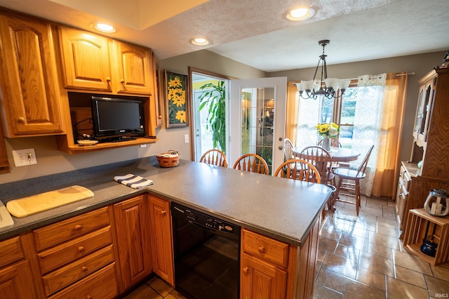 kitchen with a textured ceiling, a notable chandelier, black dishwasher, and hanging light fixtures