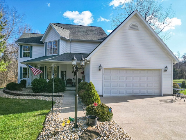 view of front property featuring a porch and a garage