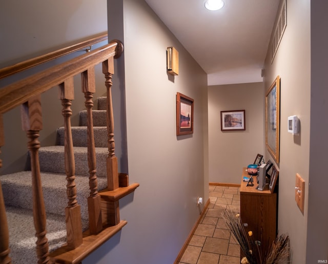 hall with light tile patterned flooring