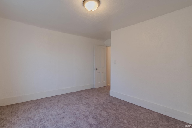 spare room featuring carpet floors