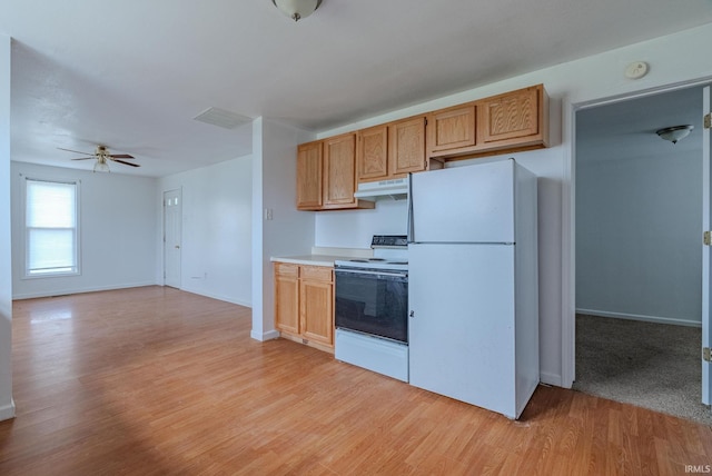 kitchen with white appliances, light hardwood / wood-style flooring, and ceiling fan