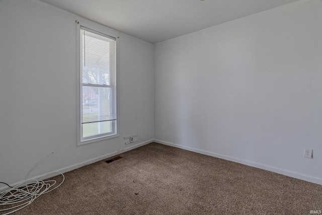 spare room featuring carpet