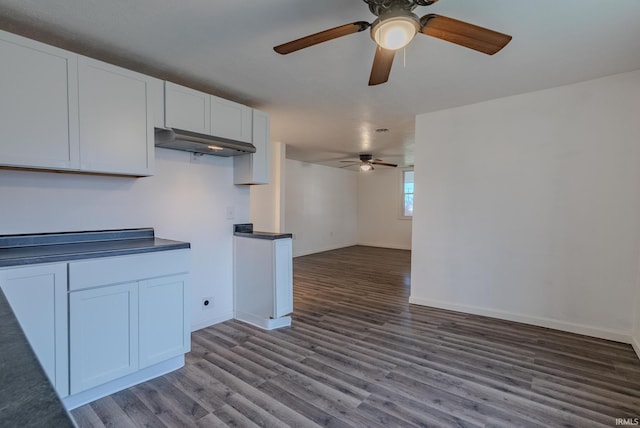 kitchen featuring white cabinets and hardwood / wood-style flooring