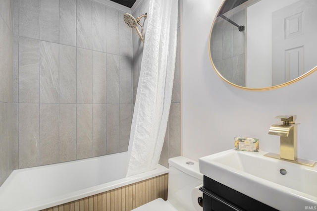 full bathroom featuring vanity, toilet, and shower / tub combo