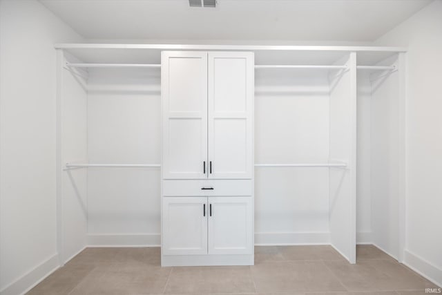 walk in closet featuring light tile patterned floors