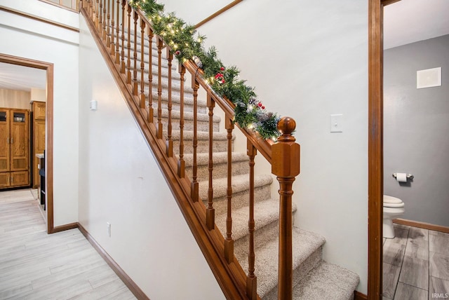 stairs with hardwood / wood-style floors