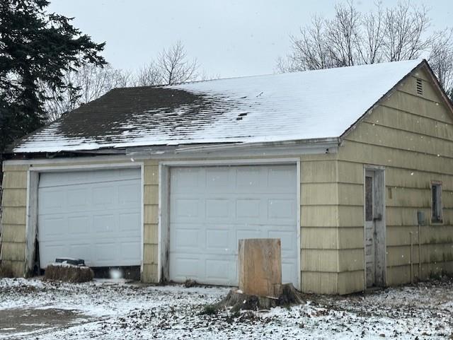 view of snow covered garage