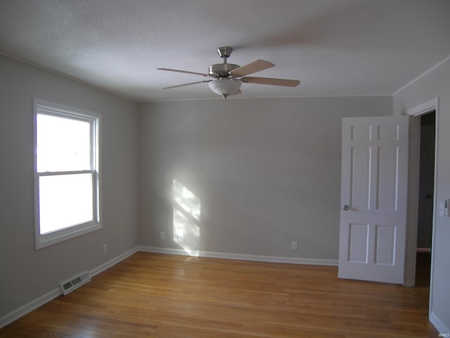 unfurnished room with light hardwood / wood-style flooring and ceiling fan