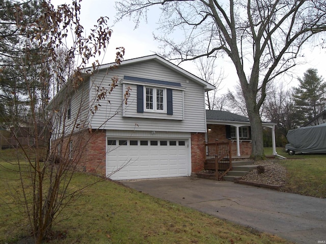 view of front of home with a front yard and a garage