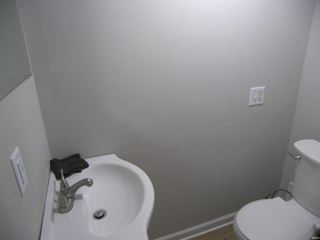 bathroom with sink and toilet