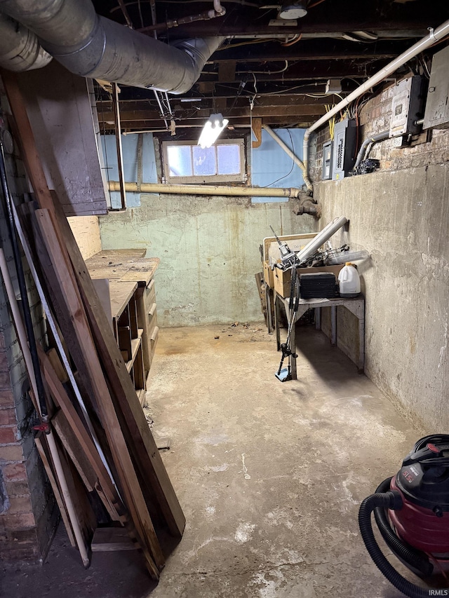 basement featuring electric panel