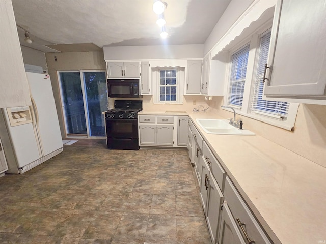 kitchen featuring black appliances and sink