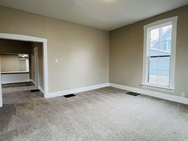 unfurnished room featuring carpet floors