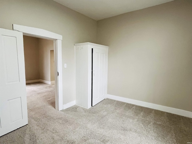 empty room with light colored carpet