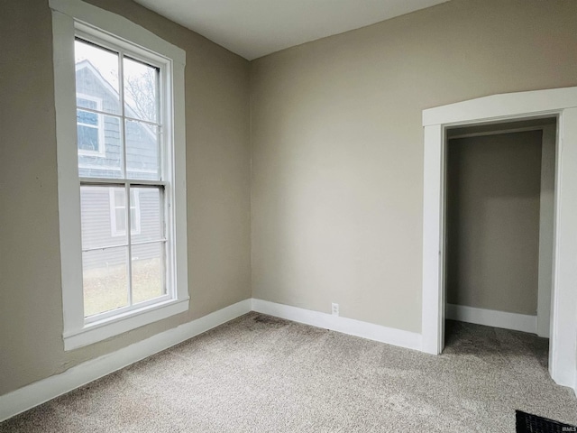 empty room with carpet flooring