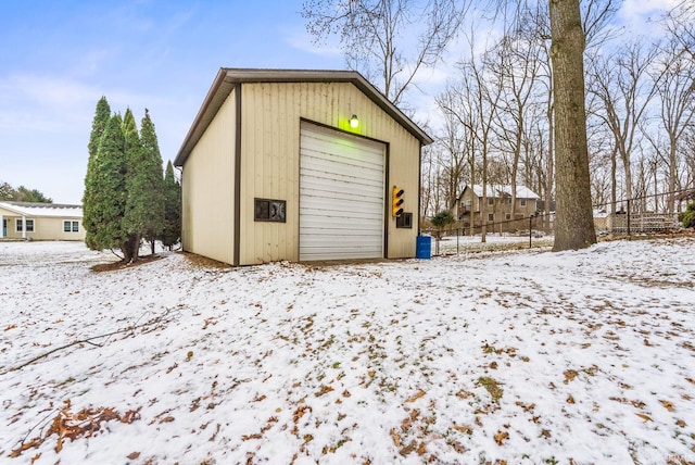 view of snow covered garage