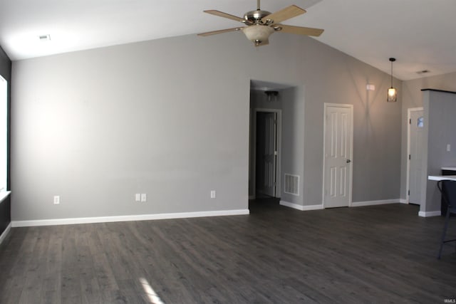 unfurnished living room with ceiling fan, dark hardwood / wood-style flooring, and vaulted ceiling