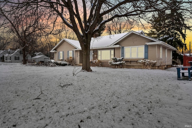 view of snow covered house