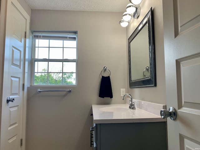 bathroom featuring vanity and a textured ceiling