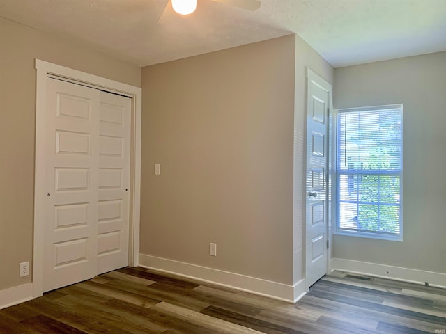 entrance foyer featuring ceiling fan and dark hardwood / wood-style flooring