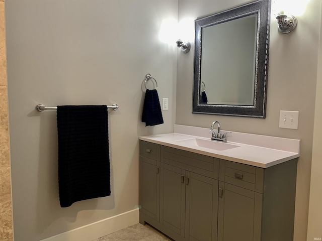 bathroom featuring tile patterned flooring and vanity