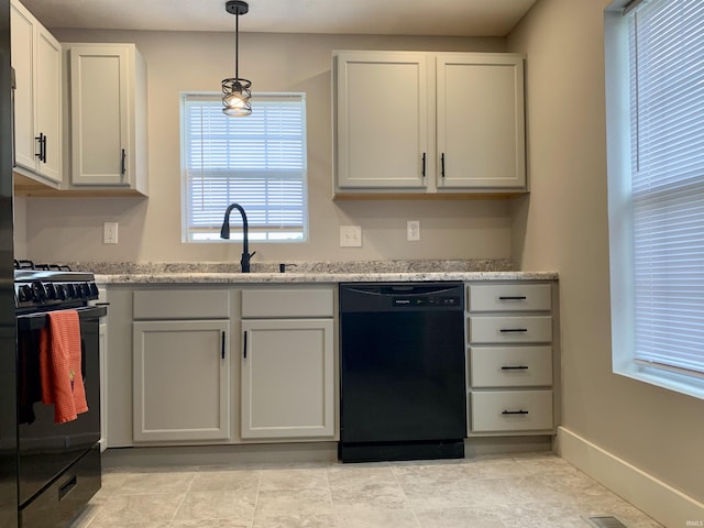 kitchen featuring black appliances, white cabinets, sink, hanging light fixtures, and light stone counters