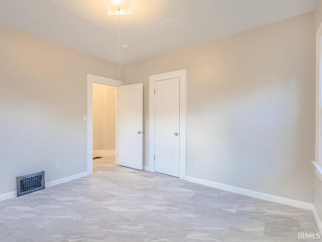 unfurnished bedroom with a closet