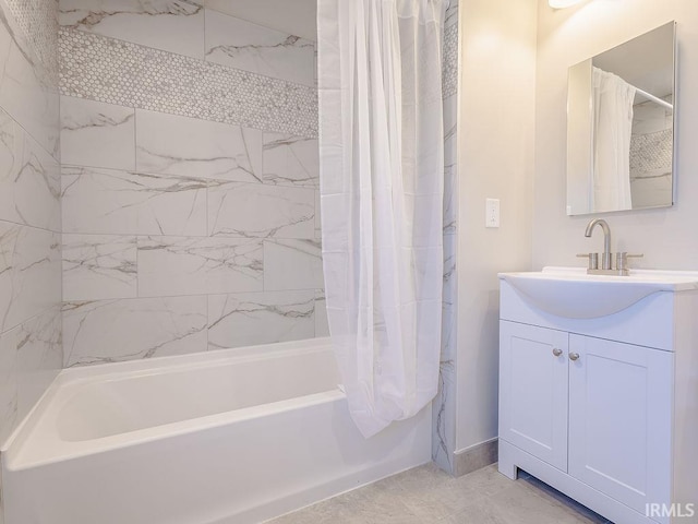 bathroom featuring shower / tub combo and vanity