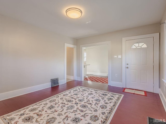 entrance foyer with dark hardwood / wood-style flooring